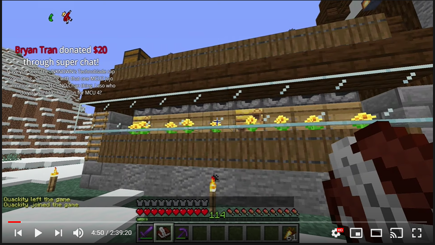 This is a screenshot of Techno's stream where he's showing off his finished bee farm. It's a small spruce extension to his house. Through the windows, we can see yellow dandelions all in a line, and behind that, a row of bee hives. A ladder on the side leads to the roof.